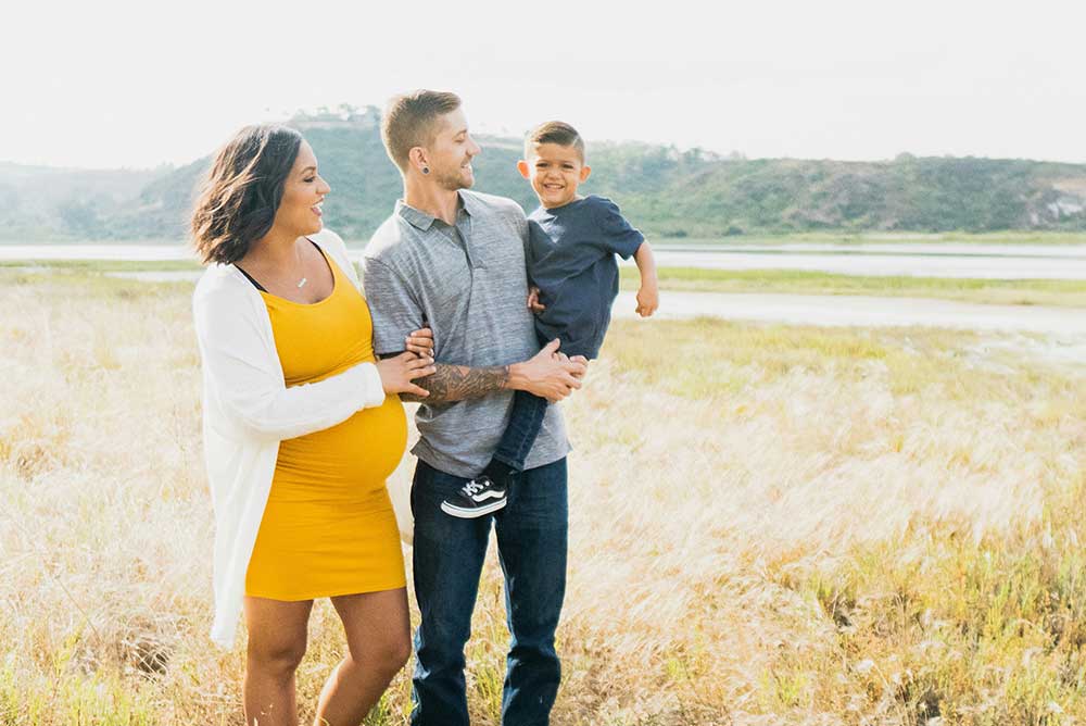Man, Woman and Child in a field